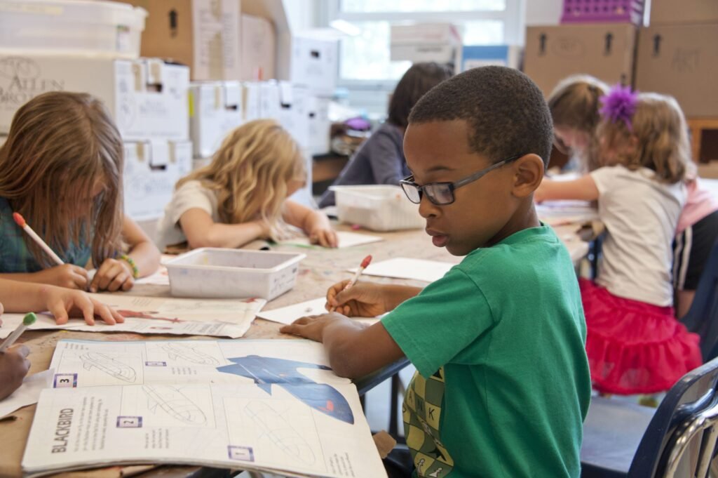 pexels-photo-3992949-3992949 Group of children focused on educational activities in a classroom setting.